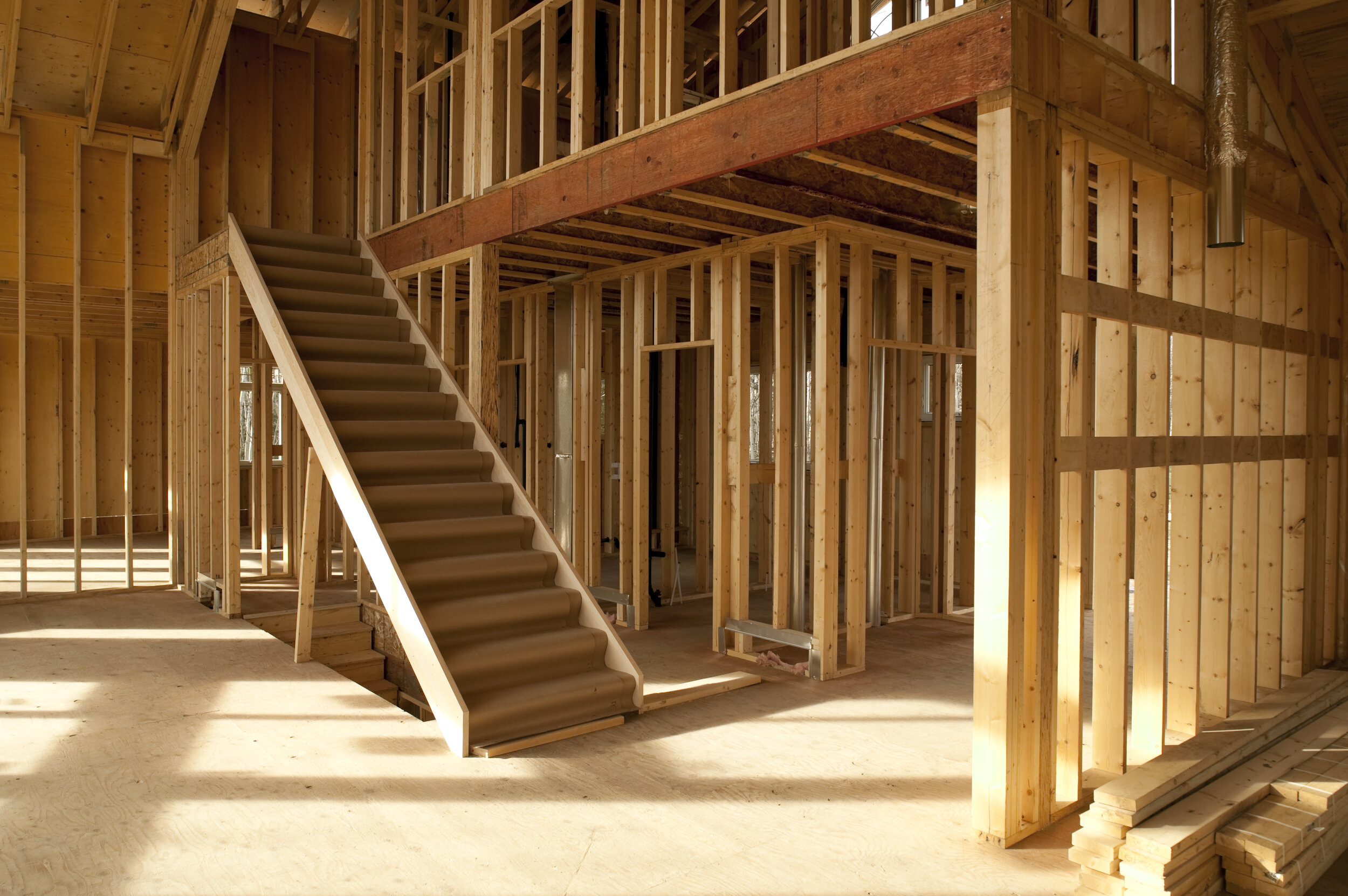 interior of house under construction wood framing studs
